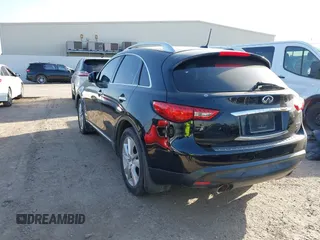 2014 Infiniti QX70 with VIN JN8CS1MU5EM450712, listed as a IAAI auction lot 41734354 with 164,349 mi miles and . Bid and sale history available at DreamBid. Image 3.