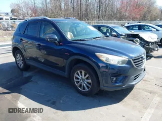 2016 Mazda CX-5 Touring with VIN JM3KE4CY0G0631786, listed as a IAAI auction lot 41761214 with 220,058 mi miles. Bid and sale history available at carsss.com. Image 1.