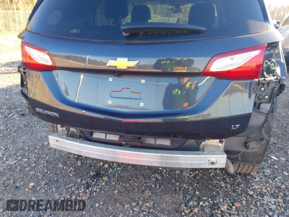 2019 Chevrolet Equinox LT z VIN 3GNAXKEVXKL243487, wystawiony jako IAAI lot #41217077 z przebiegiem 62 119 mil mil oraz . Historia ofert i sprzedaży dostępna na DreamBid. Obrazek 18.