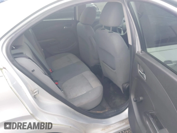 2013 Chevrolet Sonic LS z VIN 1G1JA5SH7D4197354, wystawiony jako IAAI lot #41764102 z przebiegiem 154 401 mil mil oraz . Historia ofert i sprzedaży dostępna na DreamBid. Obrazek 8.