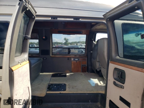 2002 Chevrolet Express z VIN 1GBFG15R521239354, wystawiony jako Copart lot #72501904 z przebiegiem 192 094 mil mil oraz Szkoda całkowita • Salvage title. Historia ofert i sprzedaży dostępna na DreamBid. Obrazek 11.