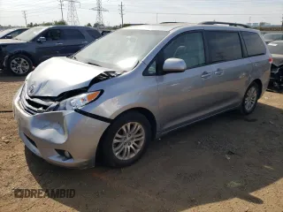 2011 Toyota Sienna XLE AAS with VIN 5TDYK3DC8BS102262, listed as a Copart auction lot 71999534 with 162,110 mi miles and Salvage title. Bid and sale history available at DreamBid. Image 1.