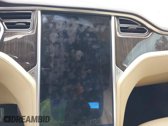 2013 Tesla Model S with VIN 5YJSA1CN8DFP21869, listed as a IAAI auction lot 41772603 with Not provided miles and . Bid and sale history available at DreamBid. Image 7.