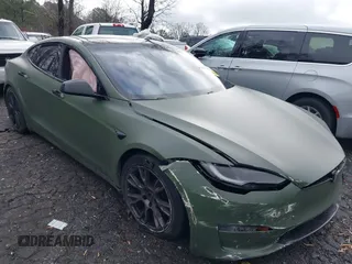 2022 Tesla Model S with VIN 5YJSA1E50NF487306, listed as a IAAI auction lot 41570528 with Not Provided miles and . Bid and sale history available at DreamBid. Image 1.