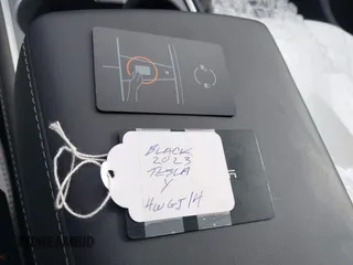 2023 Tesla Model Y Long Range z VIN 7SAYGDEE8PF826989, wystawiony jako IAAI lot #41615166 z przebiegiem 10 368 mil mil oraz . Historia ofert i sprzedaży dostępna na DreamBid. Obrazek 11.