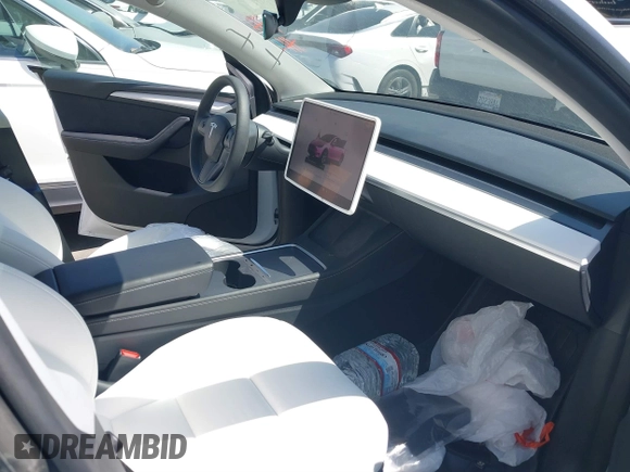 2024 Tesla Model Y with VIN 7SAYGDED2RF017448, listed as a IAAI auction lot 41597056 with 9,702 mi miles and . Bid and sale history available at DreamBid. Image 5.