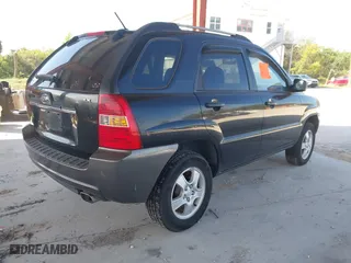 2007 Kia Sportage LX with VIN KNDJF724877450962, listed as a IAAI auction lot 41918290 with 216,476 mi miles. Bid and sale history available at carsss.com. Image 4.