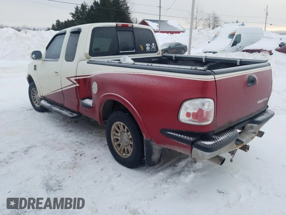 1998 Ford F-150 XL with VIN 2FTRX08L2WCA75995, listed as a Copart auction lot 43717305 with 301,987 mi miles and Salvage title. Bid and sale history available at DreamBid. Image 2.