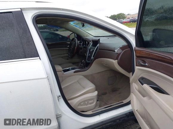 2012 Cadillac SRX Performance Collection with VIN 3GYFNEE33CS528697, listed as a IAAI auction lot 41374060 with 157,319 mi miles and . Bid and sale history available at DreamBid. Image 5.