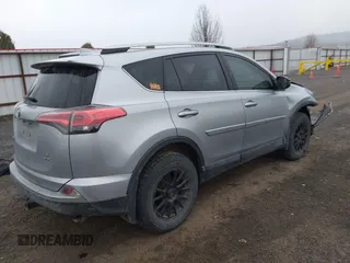 2018 Toyota RAV4 LE with VIN 2T3BFREV9JW724606, listed as a IAAI auction lot 41862028 with 98,590 mi miles. Bid and sale history available at carsss.com. Image 4.