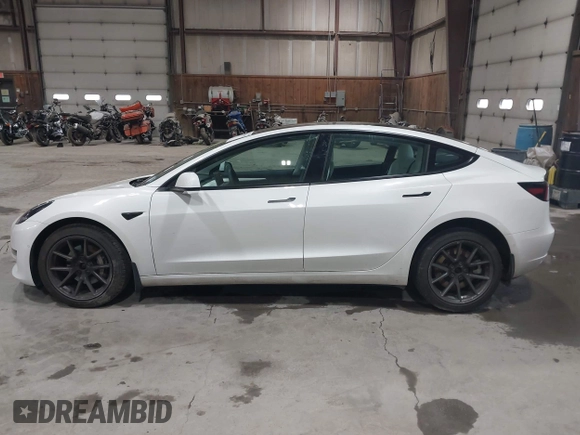 2021 Tesla Model 3 Long Range with VIN 5YJ3E1EBXMF051060, listed as a IAAI auction lot 41958018 with 65,631 mi miles. Bid and sale history available at carsss.com. Image 14.