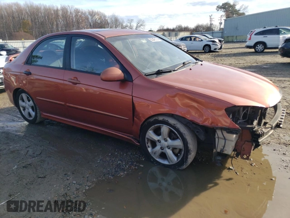 2009 Kia Spectra SX with VIN KNAFE221X95026213, listed as a Copart auction lot 85348104 with 124,171 mi miles and Salvage Title. Bid and sale history available at carsss.com. Image 4.