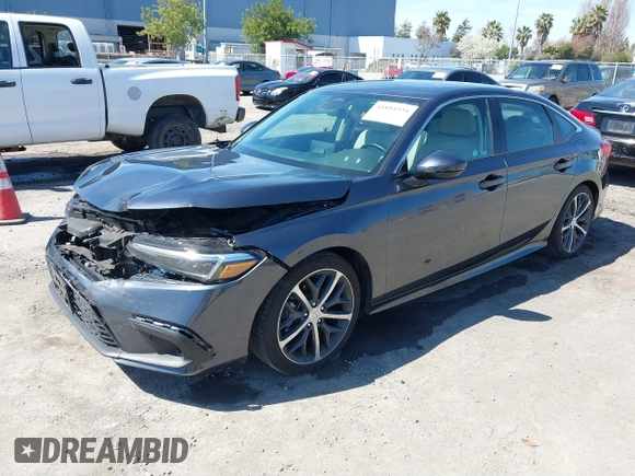 2023 Honda Civic Sedan Touring with VIN 2HGFE1F91PH310656, listed as a IAAI auction lot 41884334 with 17,691 mi miles. Bid and sale history available at carsss.com. Image 2.