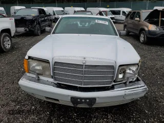 1990 Mercedes-Benz 300 with VIN WDBCA25D9LA550909, listed as a Copart auction lot 82717124 with 221,701 mi miles and Salvage Title. Bid and sale history available at DreamBid. Image 5.