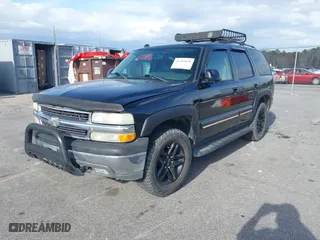 2004 Chevrolet Tahoe LT with VIN 1GNEC13ZX4J106072, listed as a IAAI auction lot 41703828 with 275,081 mi miles. Bid and sale history available at carsss.com. Image 2.
