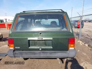 1996 Jeep Cherokee Sport with VIN 1J4FJ68S2TL299150, listed as a IAAI auction lot 41932867 with 142,761 mi miles. Bid and sale history available at carsss.com. Image 16.