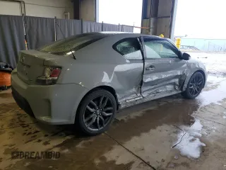 2014 Scion tC z VIN JTKJF5C7XE3071780, wystawiony jako Copart lot #47220975 z przebiegiem 102 630 mil mil oraz Szkody całkowita. Historia ofert i sprzedaży dostępna na DreamBid. Obrazek 3.
