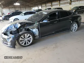 2014 Tesla Model S 60 with VIN 5YJSA1H11EFP36480, listed as a Copart auction lot 71210254 with 121,014 mi miles and Salvage title. Bid and sale history available at DreamBid. Image 1.
