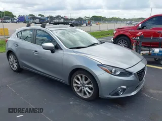 2014 Mazda 3 S Grand Touring with VIN JM1BM1M33E1114809, listed as a IAAI auction lot 42734117 with 120,927 mi miles and . Bid and sale history available at DreamBid. Image 1.