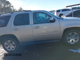 2014 GMC Yukon SLT with VIN 1GKS1CE03ER115330, listed as a IAAI auction lot 41346200 with 115,010 mi miles. Bid and sale history available at carsss.com. Image 14.