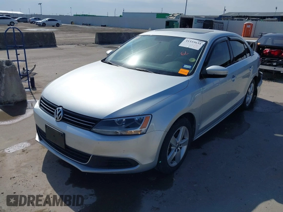 2014 Volkswagen Jetta TDI w/Premium with VIN 3VWLL7AJ6EM424935, listed as a IAAI auction lot 41533634 with 64,028 mi miles and . Bid and sale history available at DreamBid. Image 2.