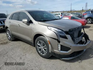 2022 Cadillac XT5 FWD Premium Luxury z VIN 1GYKNCRS9NZ180043, wystawiony jako Copart lot #51352195 z przebiegiem 12 399 mil mil oraz Szkoda całkowita • Salvage title. Historia ofert i sprzedaży dostępna na DreamBid. Obrazek 4.
