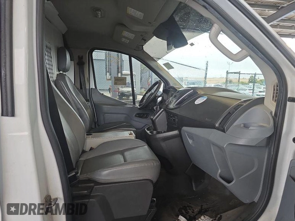 2016 Ford Transit Cargo z VIN 1FTYE1YM9GKB18600, wystawiony jako IAAI lot #42726792 z przebiegiem 127 434 mil mil oraz . Historia ofert i sprzedaży dostępna na DreamBid. Obrazek 24.