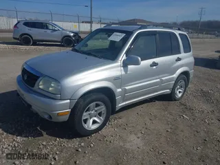 2003 Suzuki Grand Vitara with VIN JS3TD62V734105601, listed as a IAAI auction lot 42046825 with 210,728 mi miles. Bid and sale history available at carsss.com. Image 2.