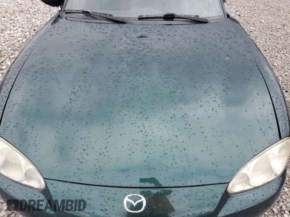 2001 Mazda MX-5 Miata z VIN JM1NB353610200693, wystawiony jako Copart lot #55385725 z przebiegiem 98 777 mil mil oraz Szkoda całkowita • Salvage title. Historia ofert i sprzedaży dostępna na DreamBid. Obrazek 11.