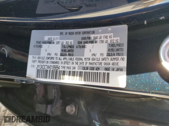 2017 Mazda CX-3 Touring z VIN JM1DKDC74H0165654, wystawiony jako Copart lot #41928295 z przebiegiem 173 567 mil mil oraz Szkoda całkowita • Salvage title. Historia ofert i sprzedaży dostępna na DreamBid. Obrazek 13.