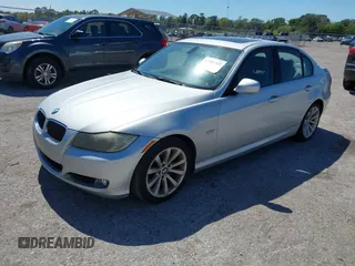 2011 BMW 3 Series 328i with VIN WBAPH7G57BNM57845, listed as a IAAI auction lot 41803365 with 243,952 mi miles. Bid and sale history available at carsss.com. Image 2.