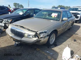 2000 Mercury Grand Marquis LS z VIN 2MEFM75W5YX627647, wystawiony jako IAAI lot #42072795 z przebiegiem 188 113 mil mil oraz . Historia ofert i sprzedaży dostępna na DreamBid. Obrazek 2.