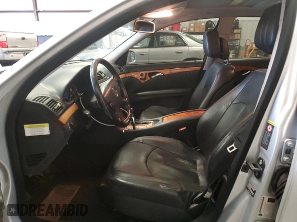2007 Mercedes-Benz E 550 with VIN WDBUF72X97B017766, listed as a Copart auction lot 48523515 with 299,578 mi miles and Salvage Title. Bid and sale history available at DreamBid. Image 7.