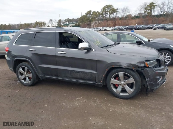 2014 Jeep Grand Cherokee Overland with VIN 1C4RJFCGXEC172008, listed as a IAAI auction lot 41719313 with 164,682 mi miles. Bid and sale history available at carsss.com. Image 13.