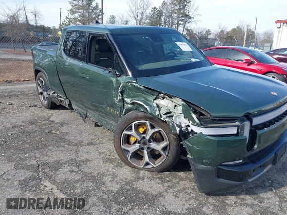 2022 Rivian R1T Adventure z VIN 7FCTGAAA8NN015369, wystawiony jako IAAI lot #41407842 z przebiegiem 22 507 mil mil oraz . Historia ofert i sprzedaży dostępna na DreamBid. Obrazek 6.