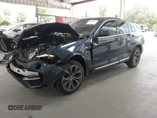 2015 BMW X4 xDrive28i with VIN 5UXXW3C51F0M87268, listed as a IAAI auction lot 42366363 with 143,285 mi miles and . Bid and sale history available at DreamBid. Image 18.