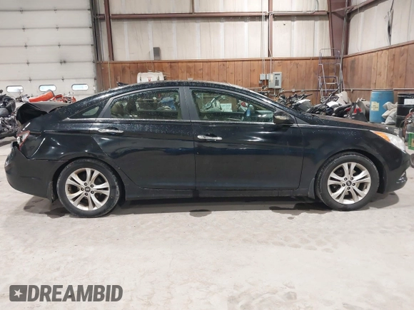 2012 Hyundai Sonata SE z VIN 5NPEC4AC9CH355351, wystawiony jako IAAI lot #42318588 z przebiegiem 122 864 mil mil oraz . Historia ofert i sprzedaży dostępna na DreamBid. Obrazek 13.