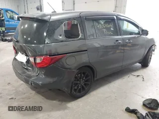 2014 Mazda 5 Sport z VIN JM1CW2BLXE0164748, wystawiony jako IAAI lot #42064606 z przebiegiem 140 169 mil mil oraz . Historia ofert i sprzedaży dostępna na DreamBid. Obrazek 4.