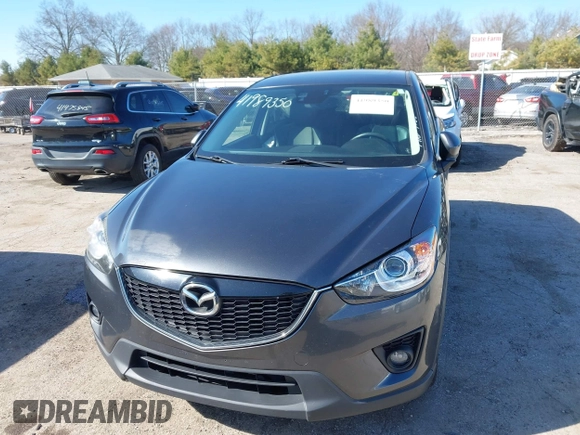2014 Mazda CX-5 Grand Touring with VIN JM3KE4DY4E0320695, listed as a IAAI auction lot 41989350 with 169,391 mi miles and . Bid and sale history available at DreamBid. Image 13.