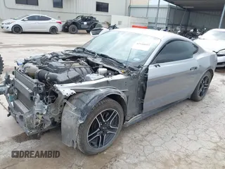 2020 Ford Mustang EcoBoost with VIN 1FA6P8TH9L5139174, listed as a IAAI auction lot 42148089 with 115,979 mi miles and . Bid and sale history available at DreamBid. Image 2.