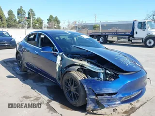 2018 Tesla Model 3 Long Range Battery with VIN 5YJ3E1EA4JF011799, listed as a IAAI auction lot 41765860 with 133,098 mi miles. Bid and sale history available at carsss.com. Image 6.