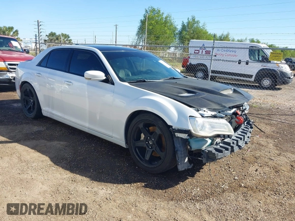 2012 Chrysler 300 SRT-8 with VIN 2C3CCAFJ9CH801749, listed as a IAAI auction lot 40912606 with 144,404 mi miles and . Bid and sale history available at DreamBid. Image 1.