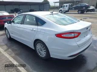 2016 Ford Fusion SE Hybrid with VIN 3FA6P0LU7GR397310, listed as a IAAI auction lot 42075891 with 124,879 mi miles. Bid and sale history available at carsss.com. Image 3.
