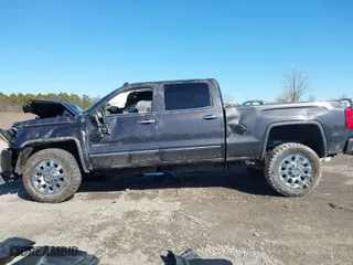 2015 GMC Sierra 2500HD available WiFi Denali with VIN 1GT120E82FF573243, listed as a IAAI auction lot 41824163 with 67,285 mi miles. Bid and sale history available at carsss.com. Image 14.