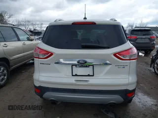 2016 Ford Escape Titanium with VIN 1FMCU9JX9GUA62674, listed as a IAAI auction lot 41838996 with 135,105 mi miles. Bid and sale history available at carsss.com. Image 17.