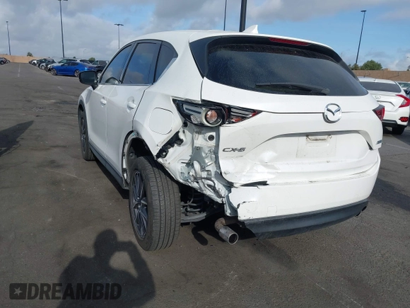 2018 Mazda CX-5 Grand Touring with VIN JM3KFADMXJ0470846, listed as a IAAI auction lot 41913533 with 54,700 mi miles and . Bid and sale history available at DreamBid. Image 6.