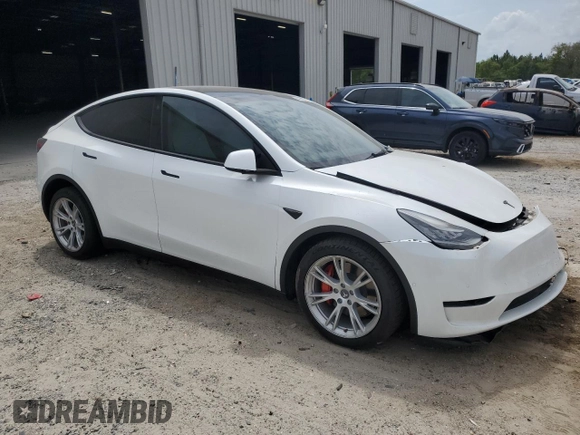 2021 Tesla Model Y Long Range with VIN 5YJYGDEE5MF203130, listed as a Copart auction lot 54642795 with 73,663 mi miles and Non Repairable. Bid and sale history available at DreamBid. Image 4.