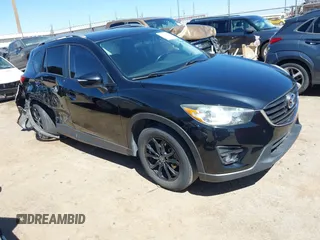 2016 Mazda CX-5 Touring with VIN JM3KE2CY8G0832209, listed as a IAAI auction lot 41877268 with 100,549 mi miles and . Bid and sale history available at DreamBid. Image 1.