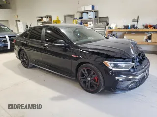 2019 Volkswagen Jetta GLI S z VIN 3VW5T7BU9KM142852, wystawiony jako Copart lot #49419395 z przebiegiem 99 203 mil mil oraz Szkody całkowita. Historia ofert i sprzedaży dostępna na DreamBid. Obrazek 4.