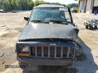1998 Jeep Cherokee Sport with VIN 1J4FT68S9WL141631, listed as a Copart auction lot 68974974 with 0 mi miles and Salvage Title. Bid and sale history available at carsss.com. Image 5.